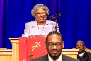 Director Ventris Gibson delivering remarks at a podium