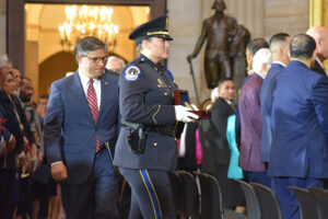 Capitol police officer carrying Heroes of Kabul August 2021 Congressional Gold Medal case