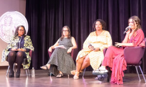 four women sit in chairs